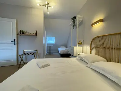 Un ou plusieurs lits dans un hébergement de l'établissement Maison des fleurs