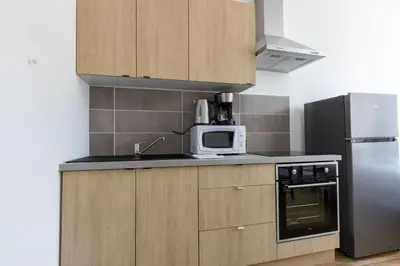 Cuisine ou kitchenette dans l'établissement Le Studio BILOBOU