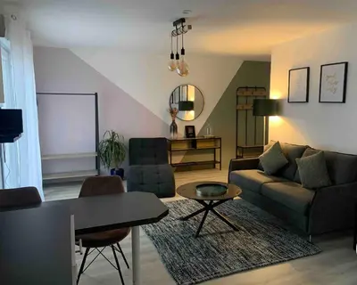 Coin salon dans l'établissement Cocon à TRELAZE