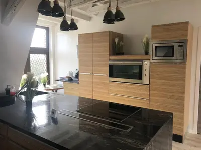 Cuisine ou kitchenette dans l'établissement GITE LOFT DE 15 PERSONNES AU CHATEAU DE JALLANGES VOUVRAY
