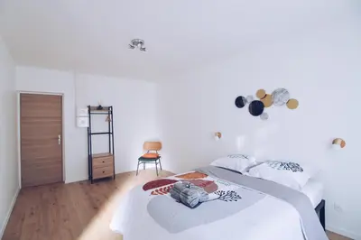 Un ou plusieurs lits dans un hébergement de l'établissement Studios Lsquare-Residence