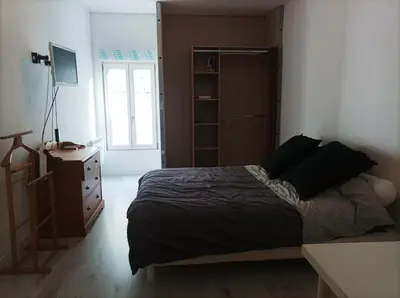 Un ou plusieurs lits dans un hébergement de l'établissement Agréable maison de ville tout confort