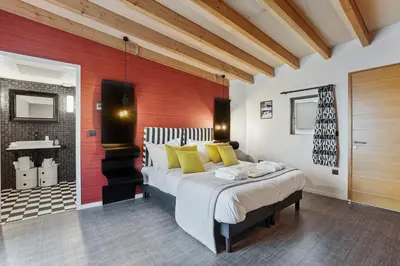 Un ou plusieurs lits dans un hébergement de l'établissement Domaine de l'Epau Eco-Resort