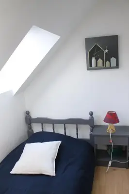 Un ou plusieurs lits dans un hébergement de l'établissement Gîte 8 personnes cadre authentique proche château du loir