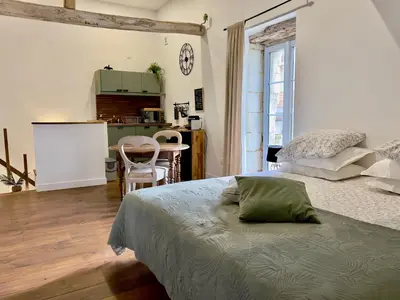 Un ou plusieurs lits dans un hébergement de l'établissement Studio la Grange