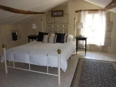 Un ou plusieurs lits dans un hébergement de l'établissement Closerie Les Roches - Charming and spacious 2 bedroom cottage