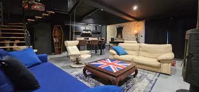 Coin salon dans l'établissement PADDOCK 24 Arnage - Loft Le Mans