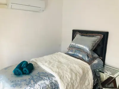 Un ou plusieurs lits dans un hébergement de l'établissement Saint dénis Appartement 1