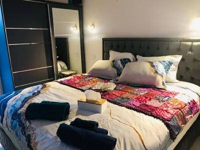 Un ou plusieurs lits dans un hébergement de l'établissement Saint dénis Appartement 1