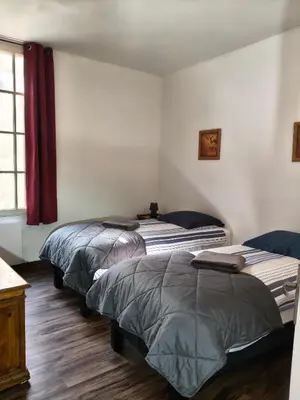 Un ou plusieurs lits dans un hébergement de l'établissement Gîte familial au cœur de Saint-Aignan séjour idéal 3 nuits à 5 min du Zoo de Beauval