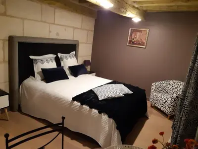 Un ou plusieurs lits dans un hébergement de l'établissement Agréables chambres d'hôtes dans maison XVIIIe