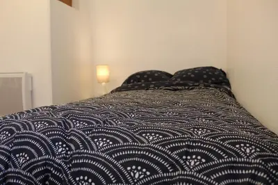 Un ou plusieurs lits dans un hébergement de l'établissement LES COTTAGES DU PRYTANEE