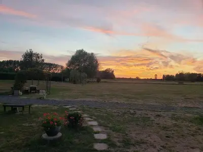 Lever ou coucher de soleil vu de la maison de vacances ou à proximité