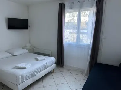 Un ou plusieurs lits dans un hébergement de l'établissement La campagne à 5 minutes de Tours.