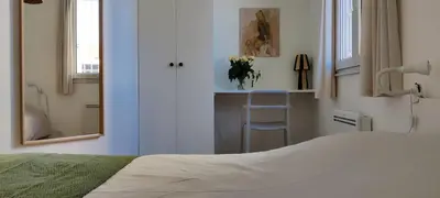 Un ou plusieurs lits dans un hébergement de l'établissement Bel appart avec chambre séparée à 5min Gare & Vinci, Stationnement Rue Gratuit