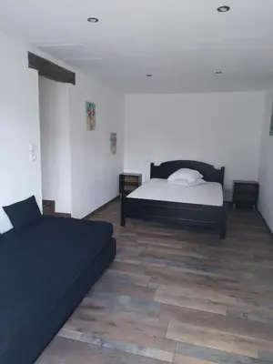 Un ou plusieurs lits dans un hébergement de l'établissement MAISON A 10MIN DU ZOO DE BEAUVAL