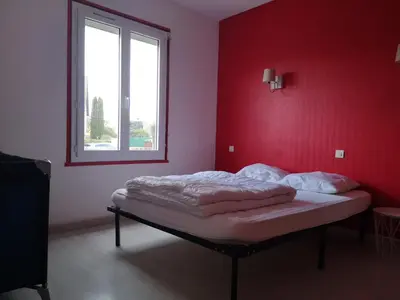 Un ou plusieurs lits dans un hébergement de l'établissement MAISON A 10MIN DU ZOO DE BEAUVAL