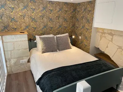 Un ou plusieurs lits dans un hébergement de l'établissement Le Lodge de Richard, studio indépendant