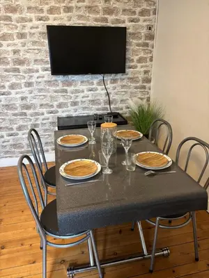 Télévision ou salle de divertissement dans l'établissement Le Char'Mans, cocon suréquipé en centre ville