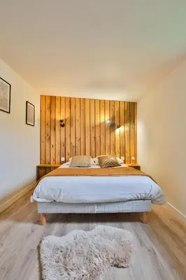 Un ou plusieurs lits dans un hébergement de l'établissement Chalet Vintage Les Belles Ouvrières