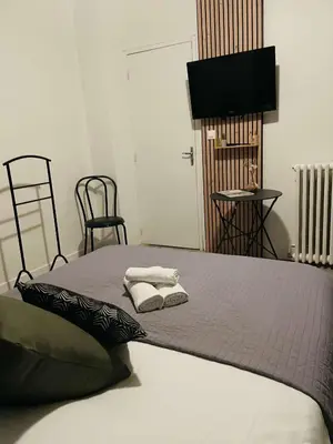 Un ou plusieurs lits dans un hébergement de l'établissement Bar du Marché - Hôtel - Restaurant