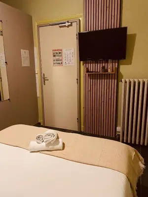 Un ou plusieurs lits dans un hébergement de l'établissement Bar du Marché - Hôtel - Restaurant
