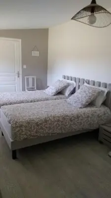 Un ou plusieurs lits dans un hébergement de l'établissement Chambre d hotes la Barrière