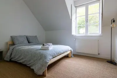 Un ou plusieurs lits dans un hébergement de l'établissement Maison au pied du Château-Cour-Proche Centre Ville
