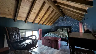 Un ou plusieurs lits dans un hébergement de l'établissement Le Cottage et la Tiny des Cartes - 2 maisons