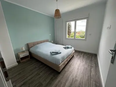 Un ou plusieurs lits dans un hébergement de l'établissement Maison Rénovée Aux Portes Du Circuit Des 24h