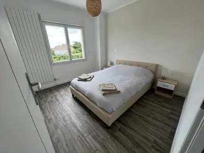 Un ou plusieurs lits dans un hébergement de l'établissement Maison Rénovée Aux Portes Du Circuit Des 24h