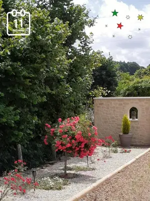 Jardin de l'établissement chambre chez habitant avec petit déjeuner