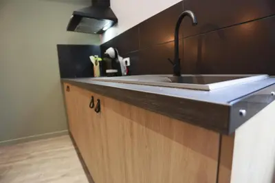 Cuisine ou kitchenette dans l'établissement Maison Le Lodge- Centre Doué la Fontaine proche zoo