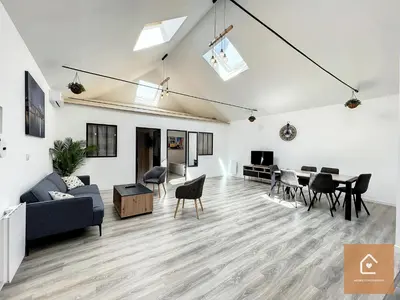 Coin salon dans l'établissement Le Loft Climatisé - 6 personnes - Entrée autonome
