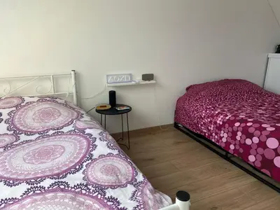 Un ou plusieurs lits dans un hébergement de l'établissement Maison 90m2 15min du circuit des 24h du Mans 9 couchages