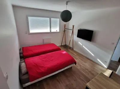 Un ou plusieurs lits dans un hébergement de l'établissement Maison neuve au calme à 2 pas du Mans et des 24h.