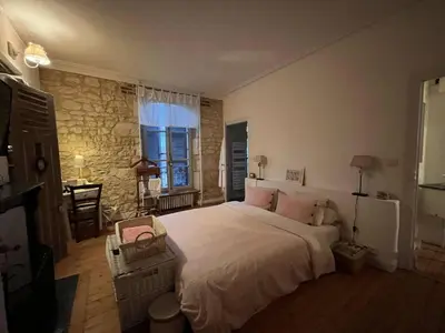 Un ou plusieurs lits dans un hébergement de l'établissement Chambres d'hôtes de charme sur LE MANS