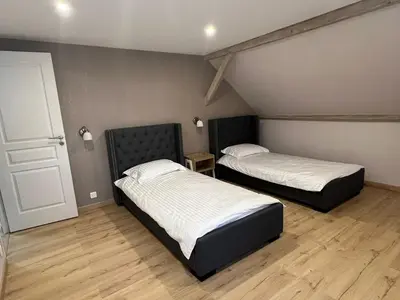 Un ou plusieurs lits dans un hébergement de l'établissement Gîte « Les Basse des Grouets »