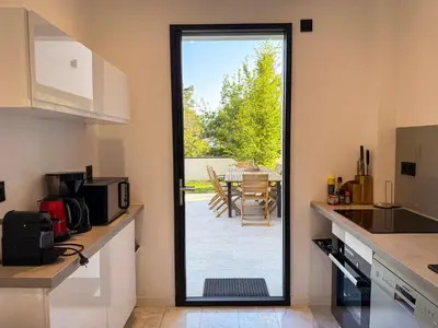 Cuisine ou kitchenette dans l'établissement Les Trois Cyprès