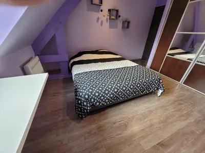 Un ou plusieurs lits dans un hébergement de l'établissement Location 24 heures du Mans auto