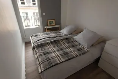Un ou plusieurs lits dans un hébergement de l'établissement Appartement LE JULES FAVRE
