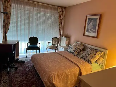 Un ou plusieurs lits dans un hébergement de l'établissement Tours, repos paisible en bord de Cher