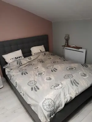 Un ou plusieurs lits dans un hébergement de l'établissement Maison confortable à Loches + Jardin spacieux