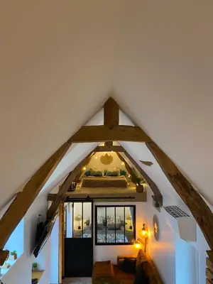 Un ou plusieurs lits dans un hébergement de l'établissement Tiny housse la Poitevinière
