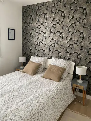 Un ou plusieurs lits dans un hébergement de l'établissement Appartement cosy près de la gare avec parking
