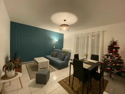 Coin salon dans l'établissement Appartement cosy près de la gare avec parking