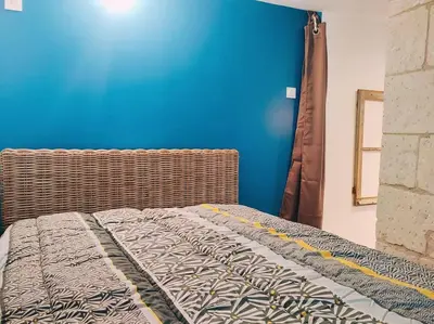 Un ou plusieurs lits dans un hébergement de l'établissement Maison chaleureuse située à Saumur