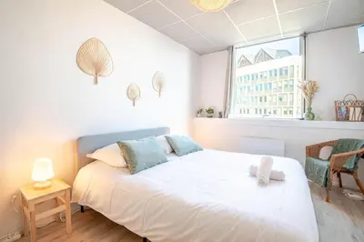 Un ou plusieurs lits dans un hébergement de l'établissement Appartement Le Cocooning