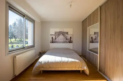 Un ou plusieurs lits dans un hébergement de l'établissement Le Cottage - circuit Bugatti - wifi - 8pers - Rêve au Mans