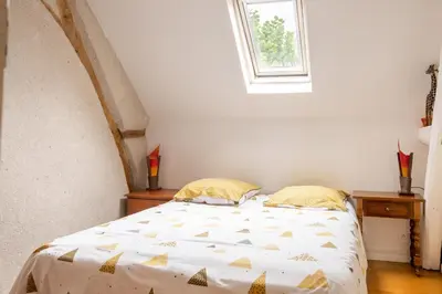Un ou plusieurs lits dans un hébergement de l'établissement Maison Meslaie - Maison pour 8 avec piscine